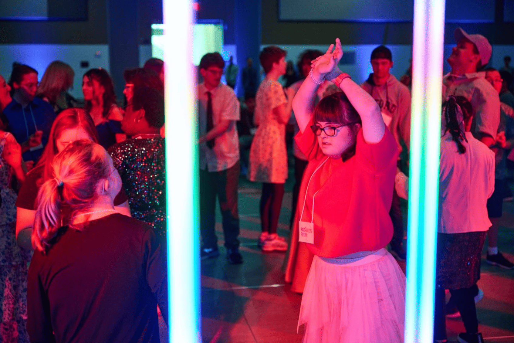 People dancing and chatting at a prom party held at Rogers Centre